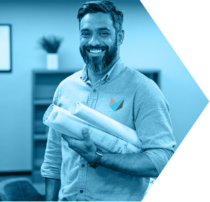 Guy smiling holding documents